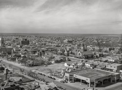 March 1943. "Amarillo, Texas. View over the city." The Firestone Tires garage on Tyler Street at 10th Avenue. Acetate negative by Jack Delano for the Office of War Information. View full size.