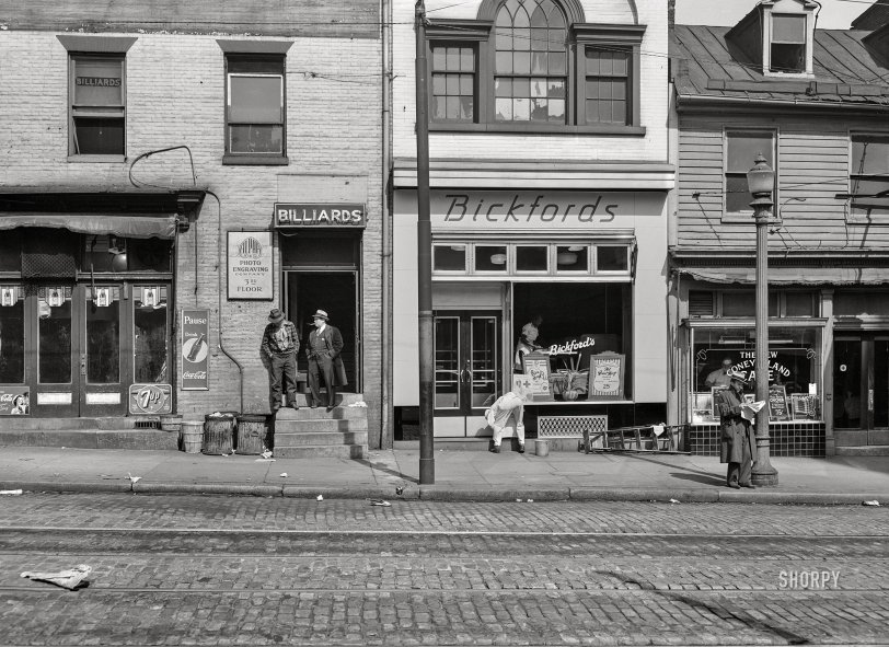 March 1943. "Baltimore, Maryland. A street scene." Billiards, Bickford's and the New Coney Island Cafe. Acetate negative by John Vachon for the Office of War Information. View full size.
