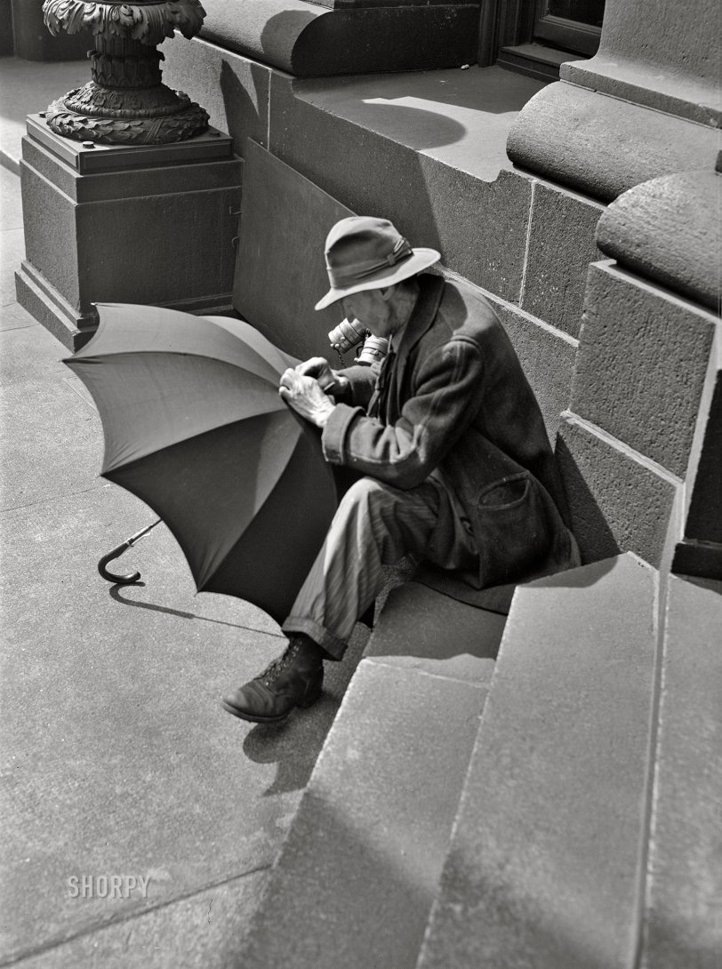 March 1943. "Baltimore, Maryland. Man repairing an umbrella." Medium format acetate negative by John Vachon for the Office of War Information. View full size.