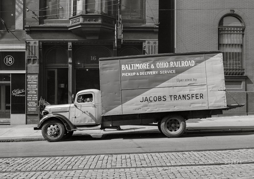 April 1943. "Baltimore, Maryland. A local delivery truck (last seen here) on South Howard Street." Acetate negative by John Vachon for the Office of War Information. View full size.