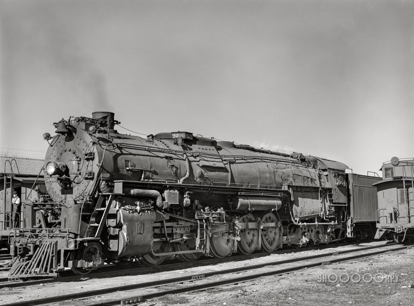 March 1943. "Vaughn, New Mexico. One of the 5000 Class Atchison, Topeka and Santa Fe Railroad freight locomotives about to leave on the run to Clovis, New Mexico." Medium format acetate negative by Jack Delano for the Office of War Information. View full size.
