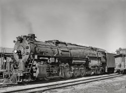 March 1943. "Vaughn, New Mexico. One of the 5000 Class Atchison, Topeka and Santa Fe Railroad freight locomotives about to leave on the run to Clovis, New Mexico." Medium format acetate negative by Jack Delano for the Office of War Information. View full size.