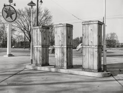 April 1943. "Detroit, Michigan. Boarded-up pumps at a closed gas station." Medium format acetate negative by Arthur S. Siegel for the Office of War Information. View full size.