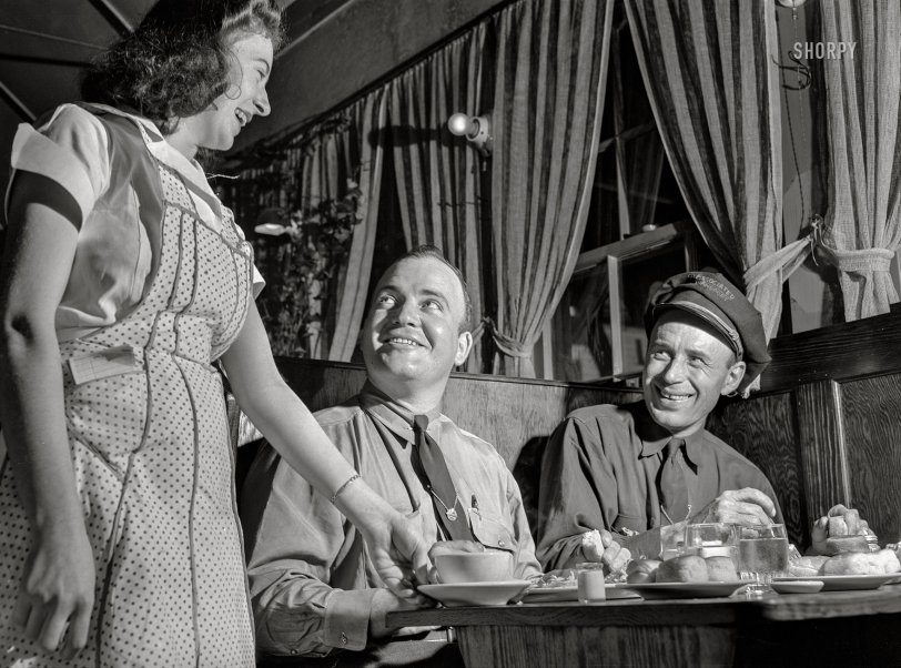 March 1943. "Jim Bishop and Joe Crow, drivers for the Associated Transport Company, eating dinner at a truckers' stop on U.S. Highway 29 near the Alabama-Georgia state line." Medium format acetate negative by John Vachon for the Office of War Information. View full size.