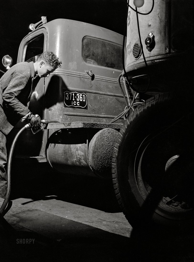 March 1943. "Truck transportation from Baltimore to New Orleans. Evergreen, Alabama -- refueling a Montgomery-to-Mobile truck at 3 a.m." Less than a hundred miles to go. Medium format acetate negative by John Vachon for the Office of War Information. View full size.
