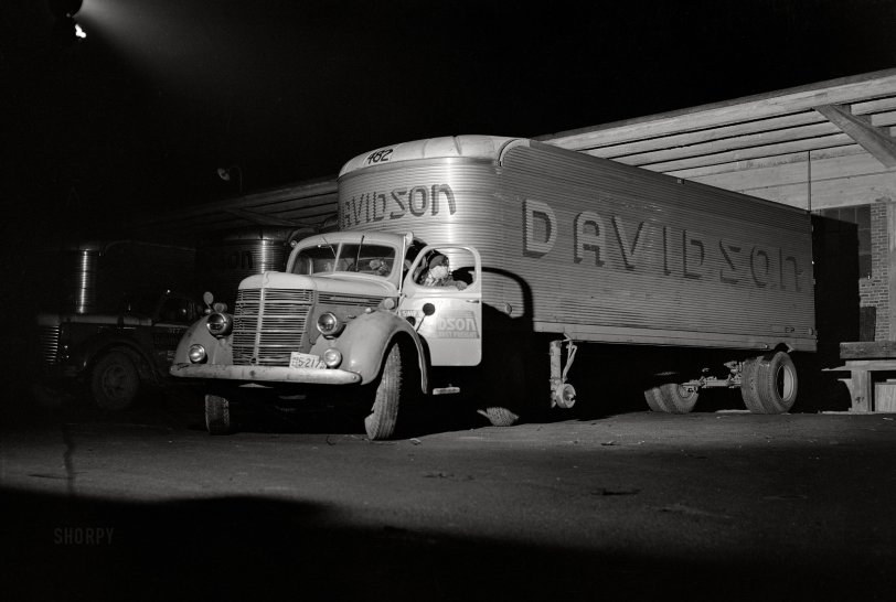 March 1943. "Baltimore, Maryland. A yard jockey backing up a truck that has just come into the unloading platform at the Davidson truck terminal." Medium format acetate negative by John Vachon for the Office of War Information. View full size.