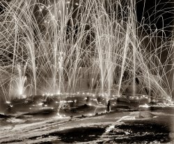 1909. "Mid-winter carnival, 'storming the fortress,' Upper Saranac Lake, New York." 8x10 inch glass negative, Detroit Publishing Company. View full size.
Not what it seemsSomebody got a Spirograph for Christmas!
SuperbJust simply a breath-taking photgraph!  What more need be said!  A very Merrye Christmas and a Rousing New Year to all the Shorpy Family!  Thank you, Dave! You've made 2011 a treat, I wonder what new adventures await?
Night of LightsWishing all who enter this wonderful website a Merry Christmas and a Happy, HEALTHY, New year.
This beautiful picturecould easily have been taken in the present day!
Winter FestivalNotice in the background the "Ice Palace" constructed of blocks of ice harvested from the lake.  The 2012 "Saranac Lake Winter Festival" will mark the 114th anniversary of this great northern New York Adirondack Town's mid-winter tradition!  The Palace was originally referred to as the "Ice Tower" and evolved to the Palace name.  It is constructed largely the same way today as it was 114 years ago, albeit with some improvements in saw technology!  History buffs might enjoy this link:  www.saranaclakewintercarnival.com/history/
(The Gallery, DPC)