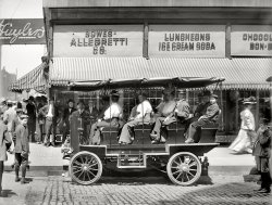 Circa 1908. "Seeing Chicago. Auto at Monroe Street near State." Our second glimpse of these Windy City tourists. Photo by Hans Behm. View full size.