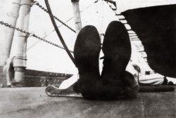 aA tired sailor aboard the USS Colorado kicks back for some R&amp;R. View full size.
(ShorpyBlog, Member Gallery)