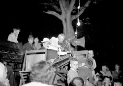 At the Saturday night square dance on the Saugatuck, Michigan village square, c. 1948. Photo by Bill Simmons. View full size.
(ShorpyBlog, Member Gallery)