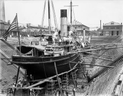 Maintenance being done on the USS Potomac (AT-50) in Dry Dock No. 1 of League Island (Philadelphia Naval Yard) in 1907. 6½ x 8½ inch glass negative. View full size.