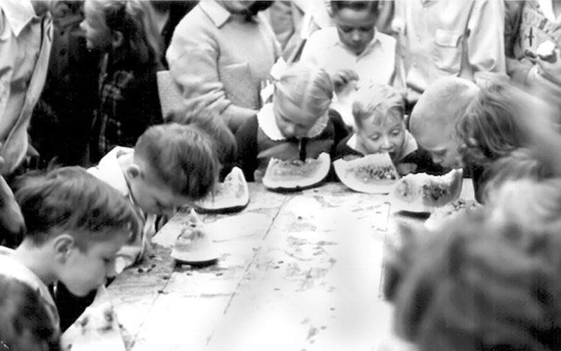 Me and my sloppy sister get into a watermelon eating contest at the W.T.Rawleigh Company picnic. It is the summer of 1947 at Moose Park south of Freeport, Illinois. View full size.
