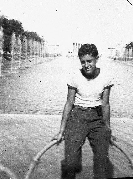 Taken at the World's Fair in July 1939, my very first trip to the fair. I stayed there all day and into the night, where I listened to the Hal Kemp orchestra play to the happy dancers on the dance floor. I remember taking in many of the exhibits, such as General Motors, Westinghouse, Con Edison, and seeing the famed parachute tower.
This photo was taken with a very small folding camera which was given away by the Manischewitz Bread Company if you sent in three wrappers of their bread. The camera was so unique, it accepted 00 size film, making it difficult to find a processor for that film. View full size.
