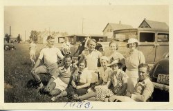 Grandma (in the polka-dot dress) and Grandpa Poeschl (sitting next to her) in 1933 after a Bavarian Soccer Club game, Milwaukee WI.  Grandpa was a longtime player for the Bavarians (he had the cinder remnants in his knees to prove it) and was inducted into the WASA Hall of Fame in 1985.  Am assuming from the photo, that their team won the game that afternoon - either that or they were a happy bunch of sore losers. View full size.