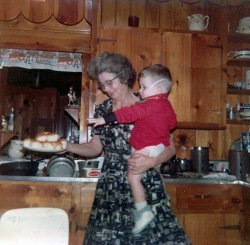 My Grandmother having a difficult time holding me and the plate as I'm reaching for a biscuit, 1966. She used to cook biscuits from scratch along with red eye gravy. She was so good to me. I miss her terribly. View full size.