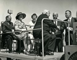 When Ford opened its new Broadmeadows plant in suburban Melbourne on 27th January, 1960, it was a big deal. The Prime Minister, the Rt. Hon. R.G. Menzies, opened the plant at 2:35 pm, and a trailer train tour of the plant followed. A black tie evening dinner party at the Menzies Hotel in Melbourne wrapped up the day. In this photo on the trailer train from left to right are Henry Bolte, premier of the State of Victoria, and his wife; my mother, Betty; Prime Minister Menzies; my father, John McIntyre; and unknown. See This story of the recent announcement of the closure of the Broadmeadows plant. View full size.
(ShorpyBlog, Member Gallery)