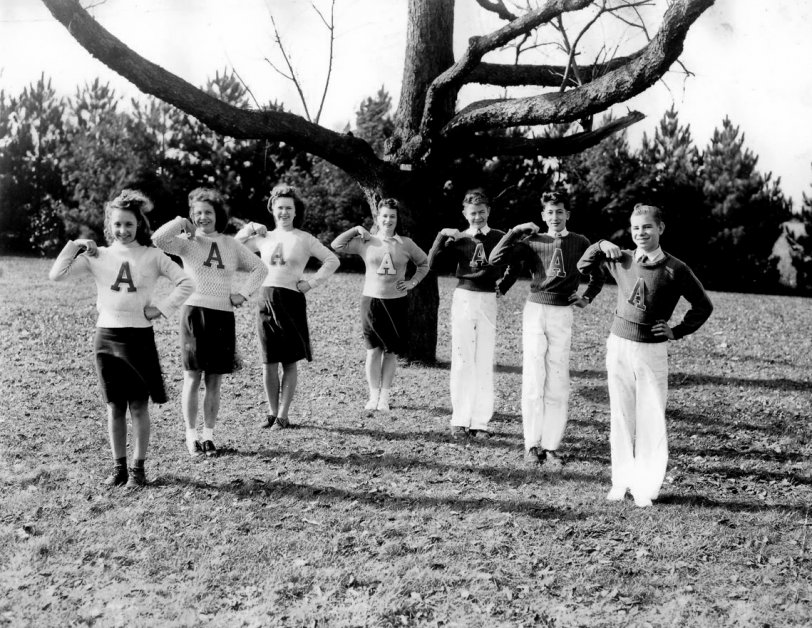 From the same album as the football team, presumably these kids cheered for the team in the other picture. [Sue Sylvester is just outside of the picture yelling at them.] View full size.
