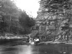 It's hard to tell if this mysterious trio is sitting on the rocks at the base of the cliff or if they're on a raft.  I have no idea who they are or why they're out there.