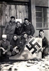 Companion photo to one already posted from an unknown air base in England during WWII. It was apparently taken at the same time. It's hard to miss FW190 tail. Dad had "Snuffy" painted on his jacket. I never heard him mention this nickname. View full size.