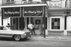 Driving back from Pensacola, Florida after my Navy School graduation in 1968, my friends and I decided to stop by the Playboy Club in Biloxi, Mississippi. That is me with my foot on the Caddy. One friend is taking the photo; the other friend is inside. The guys out front against the wall are unknown to me. I looked for the building, but I guess it has been torn down. I only had the numbers "729" on the wall of the building to work with.
Biloxi Playboy Club?!The club was on Bienville Street in the French Quarter, New Orleans.
[It was actually a block over at at 727 Iberville, which now houses the "Penthouse Club." The upper portion of the building seems a close match. -tterrace.]

(ShorpyBlog, Member Gallery)