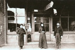 L-R: Lee Owings (Newsstand), Grace Vedder (Assistant Postmaster), Edward Bonapart Smith (Postmaster). Picture was taken about 1890 at 110 East Sherman Street, White Hall, IL.