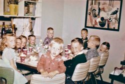 This is a photo of my sister Becky (the little girl far left) at her birthday party; I'm unsure of the year. I love how Mom is either spying on the goings on, or hiding from the camera! A note about the artwork on the wall: my Dad was a graphic designer, and that piece is an example of his work. Sadly, it was lost in a move many years ago. View full size.
Sure it was Becky&#039;s BD?It's a little girl's birthday party, and all nine of the guests are boys?
She was outnumbered!Two of the boys were my brothers...I wasn't born until 1963. They were living at Edwards AFB at the time...my dad was in the Air Force, and most of the neighbor kids were boys.
[So the year this was taken was probably . . . - tterrace]
BeautyYour Mom &amp; Sister were beautiful women (or girl in one case). Thanks for the photos.
(ShorpyBlog, Member Gallery)