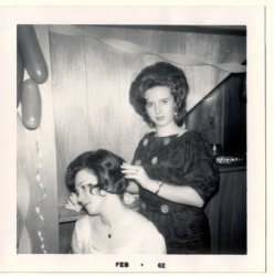 My Aunt Dolores styling my mother's hair in my grandmother's basement rec room, February, 1962. My mother was 13, and my aunt was probably 20. Dolores would own her own salon, Mason Maurice, after studying in Paris. She bought me my first set of clippers when I was 11. I haven't paid for a haircut since. She passed away a year and a half ago, and we've all missed her so much. This is my first submission, and I dedicate it to my Aunt Dolores, who was also an award-winning amateur photographer. View full size.