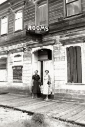 One of the same women who previously was seen posing in slacks and pedal pusher shorts, with a car and her sister, puts on a dress to pose with her mother in front of a California ghost town motel. From a collection of photos I found in a Simi Valley, California antique store. View full size.
(ShorpyBlog, Member Gallery)