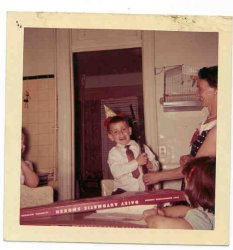 My first Daisy! Box says "Daisy Automatic Smoker" so I guess it's not a bb gun. Then again this was NYC folks, where such "dangerous weapons" are illegal. Guessing the date here is around 1960. That's my mom on the right and my first "girlfriend" in the foreground. View full size.