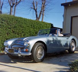 Another photo of my dad with his new '67 Austin Healey 3000 in early 1968. He was a newspaper reporter and he has his "Murrow" London Fog trench coat on for the chilly top-down morning drive to Oakland (S.F. Bay Area). He made a small sticker with a label maker (remember those?) that said, "Disraeli Rides Again!" and it was applied on the inside of the glove box door. View full size.
What a beautiful carCerrito68,thank you for your great pictures. I wonder how long your Dad had this car.
Of course, there must have been another family vehicle to transport the wife and kids. Was it a plain old American station wagon?
Perhaps you Dad's car was on an auction of some sort in later years? They are quite collectible.
I see the Healys are selling for quite a lot;witness this example on Ebay.
http://cgi.ebay.com/ebaymotors/Austin-Healey-3000-Mk-III-Frame-off-resto...
ThanksDad sold the Healey in 1980 for, I think, 4500 dollars.  My orthodontist was interested but someone else bought the car.  Yes, in recent years "big" Healeys can fetch impressive sums.  I only wish Dad's was in my garage today.  
(ShorpyBlog, Member Gallery)