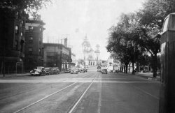 This photo is from my Grandpa's collection. He wrote on the back, "Hennepin Avenue looking toward the Basilica. Taken in front of the old Plaza Hotel across the street from Loring Park." It has a stamp on the back that says Brown Photo service, October 1943. View full size.
Current view.View Larger Map
Couple of things missing now.
(ShorpyBlog, Member Gallery)