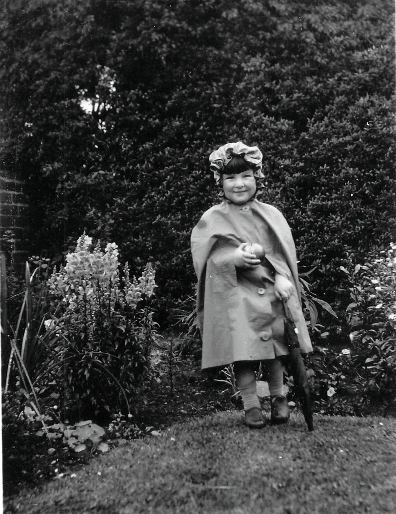 My mother, age about 4 (1928), in Dumfries, Scotland, dressed for the weather. View full size.
