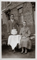 My Great Grandparents, William Bowie McIntosh and Jane Spence Soutar, on their what may be their 50th wedding anniversary. He was an engineer who worked at Vickers Armstrong where he invented and patented a valve for Vickers, at Barrow. He was also a Lay Preacher and a "Keir Hardie" man (trade unionist). He also taught apprentices English in his spare time. He died in 1935.
Mom remembers him having a rather brassy red (Mom corrects me... It was dark black, despite his little remaining hair being grey) toupée. She accidentally pulled it off when she was very small and recalls him being very angry with her. He was normally a very nice man. Her grandmother on the other hand was very grim and always complained. During the war, she came from Newcastle to stay with my grandparents. She and my grandfather had a falling out after she endlessly complained about my grandmother's cooking. One night he heard noises in the kitchen and found his mother tucking into the food that she had complained she couldn't eat at dinner time. They argued, she packed her bags, went back to Newcastle and never spoke to him again. This also caused a rift in the family and all but one of his sisters sided with his mother. View full size.
StoryThe picture is very good and evocative but it is the story that truly makes this stand out.  Thank you for the words!
Knocked my head off!Mom clearly recalls her grandfather calling to his wife "Mother! She knocked my head off!"
A number of years laterWhen my grandmother was ill with terminal cancer, one of my grandfather's sisters had sent her daughter to live with them. Because of her increasingly ill health, my grandmother was unable to continue cooking and housekeeping for an extra person (my grandfather had died by then and my mother was studying in Edinburgh) and wrote to her telling her that she regretted but the girl would have to find someplace else to live.
The girl's mother called her "selfish."
AgreedIt's the story along with the names and faces that holds my attention.  Thank you for sharing!
Great-Grandmother’s deathI recently found the following article. I had forgotten that someone in the family had been run down by an army truck during the war. Apparently it was my great-grandmother Jane McIntosh (nee Soutar).
In June 22, 1940, during an air raid readiness practice, she stepped off a tram along with two other passengers. They had their umbrellas up and did not see the Army lorry and it struck them. What the article doesn’t mention was that she died several hours later in hospital.
The other two passengers survived.
(ShorpyBlog, Member Gallery)