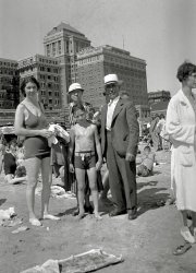 My grandfather (the kid), great-grandmother, and unidentified characters on the beach at Atlantic City, with the Chalfonte-Haddon Hall (now Resorts) rising in the background. Circa 1935. View full size.
(ShorpyBlog, Member Gallery)