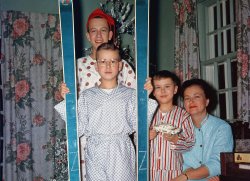 Our Christmas, 1960 in Quebec. My brothers and I are proudly displaying our haul with Mom. I've already assembled my AMT Corvair 3-in-one kit, choosing the competition mode. This must have been a prediction of things to come, as my first car in 1971 was a '65 Corvair Monza coupe. View full size.
(ShorpyBlog, Member Gallery)