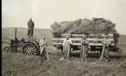 …and Young. My grandfather working (left with rake) at a neighbor's farm – I'm guessing the 1920s. He'd work his farm then also hire himself out to work others in the area as here.

The family homesteaded in Dakota Territory in the 1870s in what is now Union County in SE South Dakota a few miles from Akron Iowa. The homestead was on Bruele Creek, which is mentioned in, and the area is the setting, for the novel "Giants in the Earth" by Rølvaag. Most of the families in the area were Nordic and still reflected that when I'd visit as a child. 

Can anyone ID the year for the John Deere tractor to help place the time frame? View full size.
