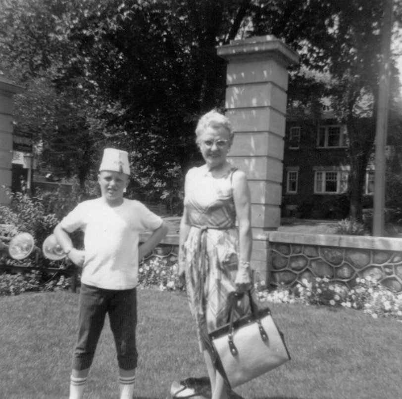 Writing on the photo says 1961, but I'm not sure which family vacation this might have been - somewhere down south, if I were to hazard a guess. New Orleans, or on the way there, maybe. Why I'm wearing a fez and pedal pushers, well, I'm completely stumped. The woman with the handbag is my maternal grandmother, Margaret McClure. View full size
