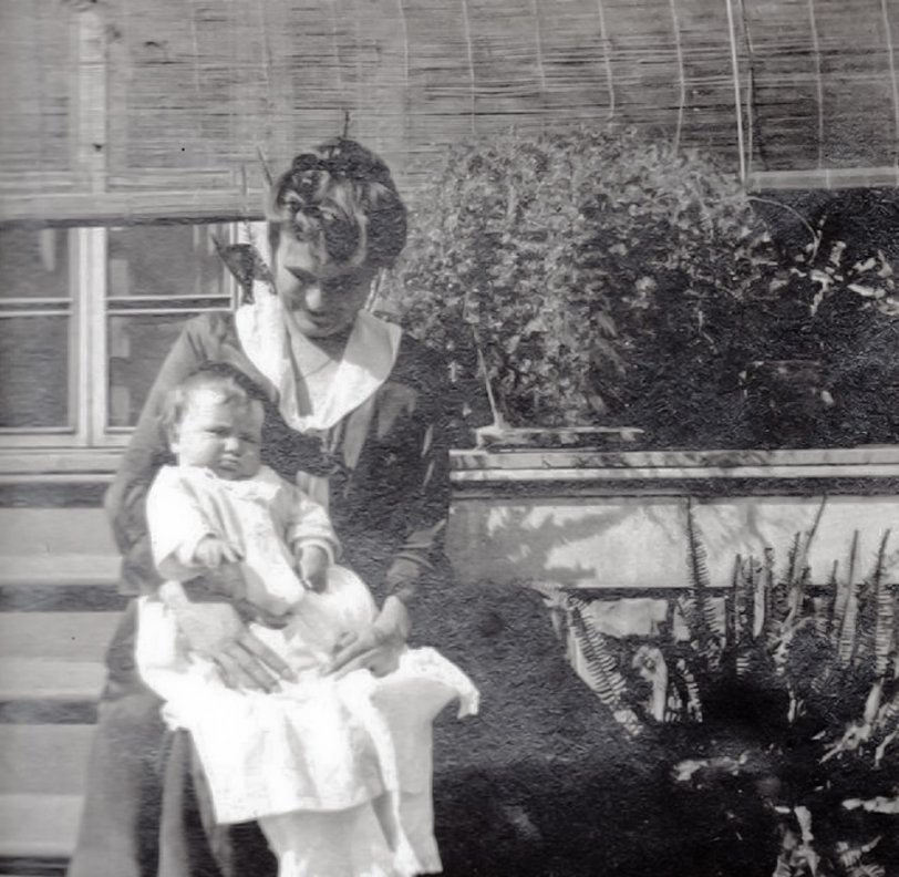 The lady is my great-grandmother, Elise Hindermann Fallon, and the baby is my grandfather, Larry Fallon. I would have tagged this for New Orleans but it could have been taken either at their house in New Orleans or my great-great-grandfather's (Elise's father-in-law) house in Pass Christian, MS. 
My grandfather was an only child and his parents eloped. Elise was actually disowned for a time but, since there are pictures of her father with my grandfather, I believe they made up. I think that Herr Hindermann didn't want her marrying an "Irishman", even though Paul Fallon was 1/2 German on his mother's side, born in the U.S, and from a family with money. View full size.
