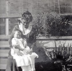 The lady is my great-grandmother, Elise Hindermann Fallon, and the baby is my grandfather, Larry Fallon. I would have tagged this for New Orleans but it could have been taken either at their house in New Orleans or my great-great-grandfather's (Elise's father-in-law) house in Pass Christian, MS. 
My grandfather was an only child and his parents eloped. Elise was actually disowned for a time but, since there are pictures of her father with my grandfather, I believe they made up. I think that Herr Hindermann didn't want her marrying an "Irishman", even though Paul Fallon was 1/2 German on his mother's side, born in the U.S, and from a family with money. View full size.
(ShorpyBlog, Member Gallery)