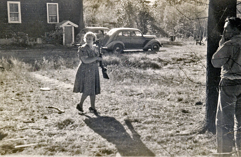 Ruth McCue (my Nana) at target practice with my uncle Frank McCue beside the tree on Fairview Ave in Wilmington, MA.  They lived in this house during the early 1940's. View full size.
