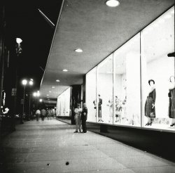 Street level view of the building lit up at night. From my negatives collection.
UPDATE: The store is Denholm and McKay, Worcester, Mass. Open until 1973.
View full size.
(ShorpyBlog, Member Gallery)