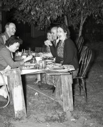 A picnic at night time? Sure why not? These people are having fun. Try it yourself. From my negatives collection. View full size.
(ShorpyBlog, Member Gallery)