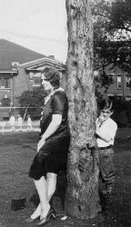 Taken sometime in late 1920's. The lady is my aunt Pearl. I do not know who the imp is. Notice the Brownie on the ground. All my family photos were taken with a Brownie box camera. It was the only camera we could afford. View full size.