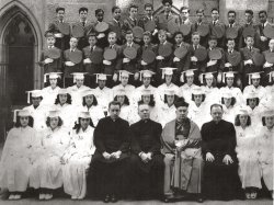 Boys and Girls  Class of 1947
Our lady of Lourdes RC School
West 143rd Street New York, N.Y.
Frank AlbaneseThe tall fellow dead center in the photo is Frank Albanese, who became a professional fighter and retired very young because of injuries.He turned to acting and has appeared in the Godfather movies I and III and was in several Sopranos episodes as well as other movies. By the way this is the Class of '47.
Oops Wrong Year!I thought this was a picture of the 1946 Class, however, I have been corrected it is the OLL Class of 1947.
[You can edit your own posts at any time by clicking the "Edit" tab. Change 1946 to 1947, then click "Submit." - Dave]
Sixty two years laterMy brother Andy stands tall top row fifth from right. Eddy McGlynn is sixth from right. Norm Brown may be in the picture, also a friend called Harcourt and Bob Philips. I miss Andy, who died in 2000. We  spent many pleasant days at Orlando Florida.
Isaura FloresAttended this school and my mom graduated from OLL also. This cuts off the right side of photo. Isaura Flores won a math scholarship to Cathedral High School. She was the first Puerto Rican to attend Cathedral on 50th street. Her grandson Eric Hernandez, NYPD, was killed a few months before she died in 2006.
I attended OLL from 1960 to '68 then moved to the Bronx. I had Mother John Fisher, Ms. Marie, Mother Eulalia, Mother Williams, Mr. Gomez. Remember lunch in the basement? I remember when we finally had a uniform fashion show and we as a school picked out the uniform change. We went from navy blue with white blouses to a peacock blue with berets, vest and skirts. The best memory was when a talented artist helped us create Wizard of Oz bird costumes for second grade.
Then there was the ballet teacher. I envied all the kids who could afford to take classes after school. I would sit and watch, sit and watch. I live in Alaska now and think about the beautiful architecture that I grew up with on 143rd Street.
Denise Salichs
nursebethat@yahoo.com
Class of &quot;47.I think I recognize Anthony Neiland "Micky" 2nd row from top, 2nd from right &amp; could be my bro Ed Moran "Eddie" next  to him. Can any one help?  We lived on Hamiliton Place. 
(ShorpyBlog, Member Gallery)