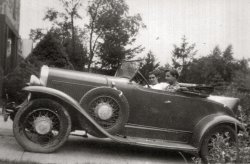 My father-in-law, Donald Johns, behind the wheel of his first car, a 1930 Pontiac roadster.  His friend Johnny Cuevas is riding shotgun. Taken in Manhasset, NY in the summer of 1944. Note the tilt-out windshield, rumble seat, original wood wheels on the rear, and replacement wire wheels on the front. The passenger side spare was a wood wheel. The car had been purchased that week for $30. View full size.