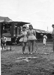 My Aunt Claire took this picture of her friends who where dancers with the Ringling Bros. Circus in 1941. That is the generator in the background. You can also see a couple roustabouts and a muscular little person.