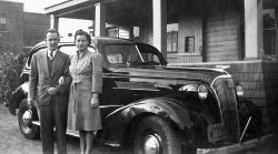 This is my mom and dad just after their marriage in 1941, taken at their close friends' home in Thorold, Ontario, located on a lane up a hill behind the post office on Main Street. Dad's first car which he had just purchased is that 1937 Chevy. View full size.
Thorold is Interested in your pictureI hope you don't mind but I shared your picture on the Vintage Thorold site (a facebook group). The people of Thorold would love to know more about you and your parents. Great photo. I took some current pictures from the same spot where this picture was taken and posted them together. https://www.facebook.com/groups/VintageThorold/ 
(ShorpyBlog, Member Gallery)