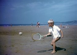 Me on holiday in Cornwall, England, August 1969. Proper wooden racket, a bit big for me though ... View full size.