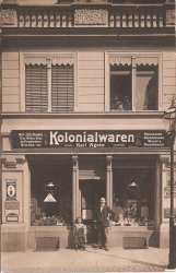 My maternal great grandparents' grocery store in Leipzig Germany. My great grandfather and great aunt in front of the store, and my great grandmother and grandmother peeking through the window above. 

Shot as a postcard by "Leipziger Bromsilber Postk.-Fabrik BROMOPHOT,  H.Jahn, L.-Kl.-Zschocher, Bahnhofstrasse 4. View full size.