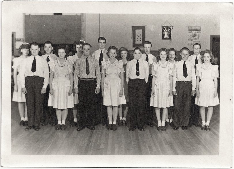 The first girl from the right in the back row is my mother and the first from the right in front is her cousin. All of the kids were from in and around Walla Walla, Washington. I love this picture, from a time when kids did productive things to entertain themselves and took pride in knowing those who were serving our country. View full size.
